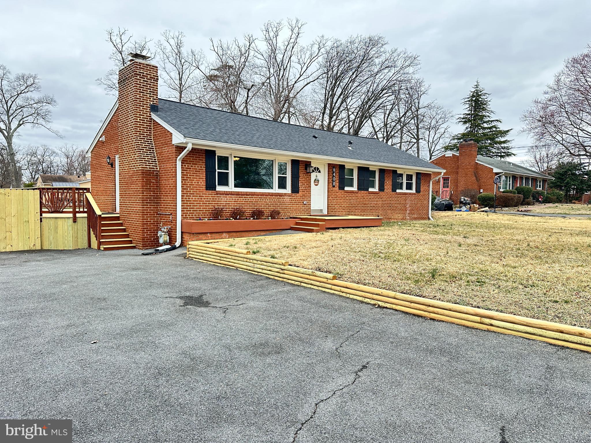 6408 Zekan Lane Springfield, VA 22150 - Photo 70 of 72 a front view of a house with a yard and garage