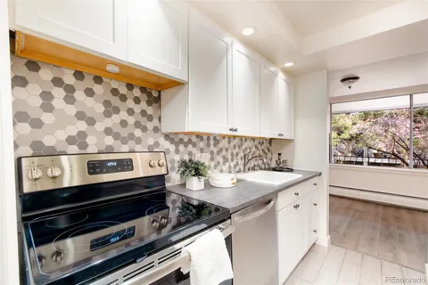a kitchen with a stove and a sink
