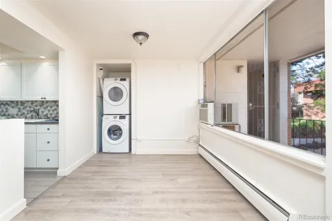 a view of a hallway with washer and dryer