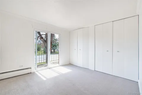 a view of a room that has a large window