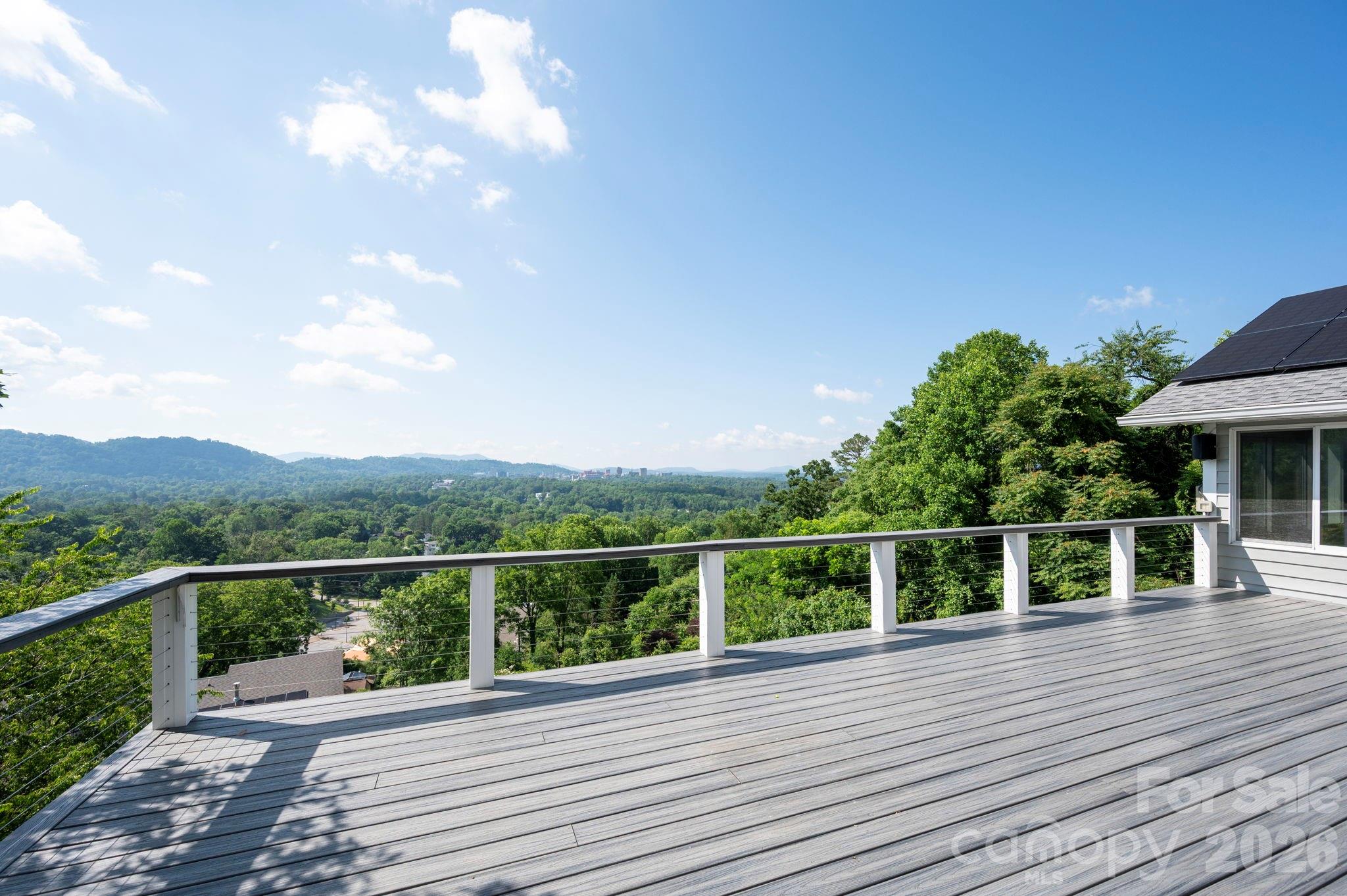 38 Lookout Road Asheville, NC 28804 - Photo 4 of 34 a view of a balcony with mountain view