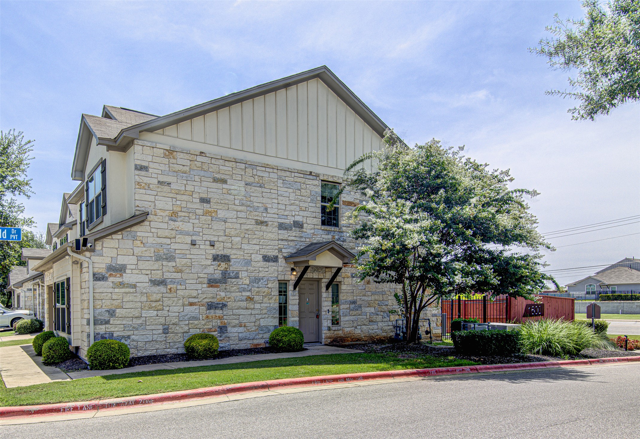 1407 Airedale Road, Unit 1104 Austin, TX 78748 - Photo 2 of 26 A striking stone and siding facade creates a welcoming exterior for this multi-level residence.