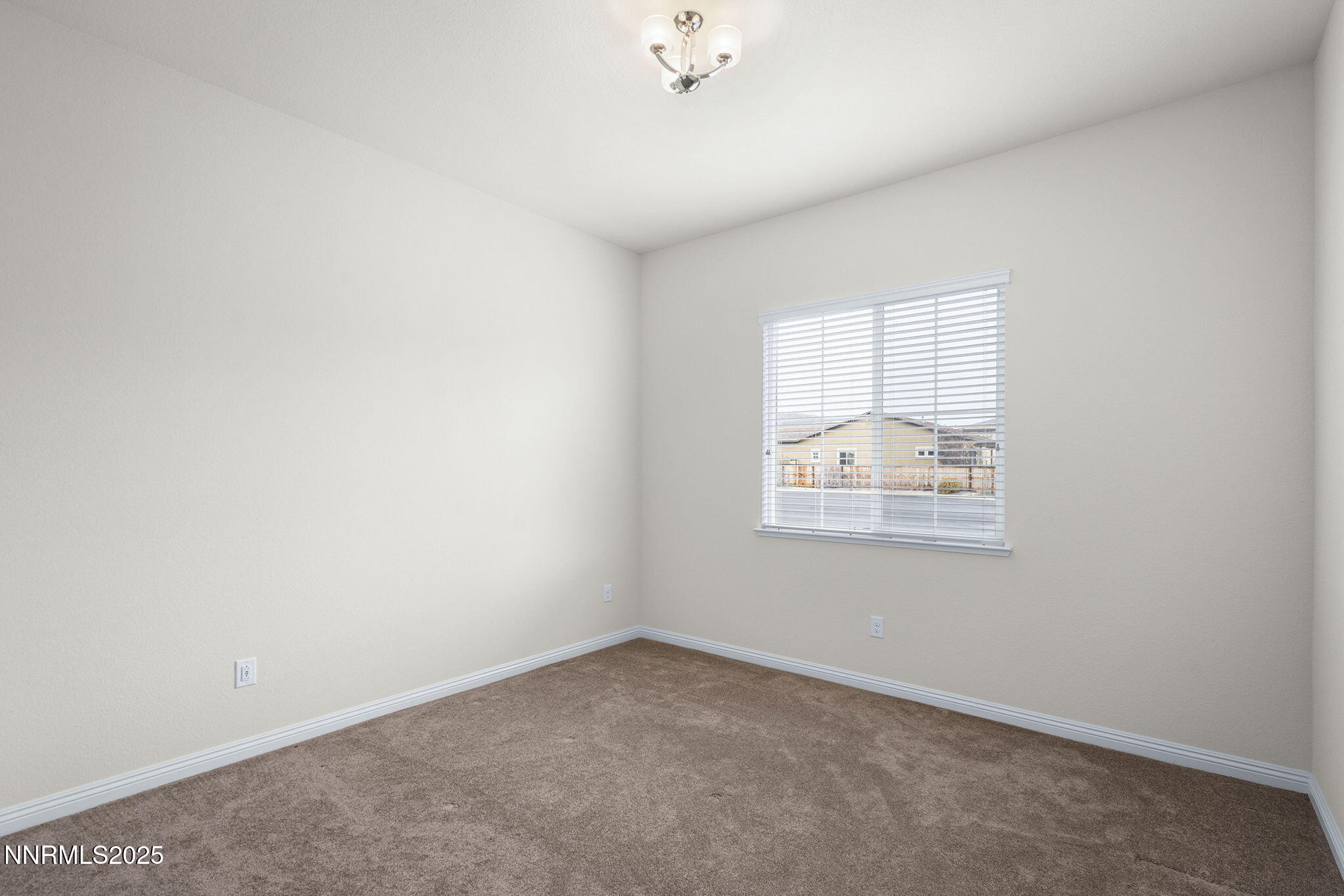 8326 Simsbury Drive Reno, NV 89439 - Photo 20 of 33 an empty room with a window