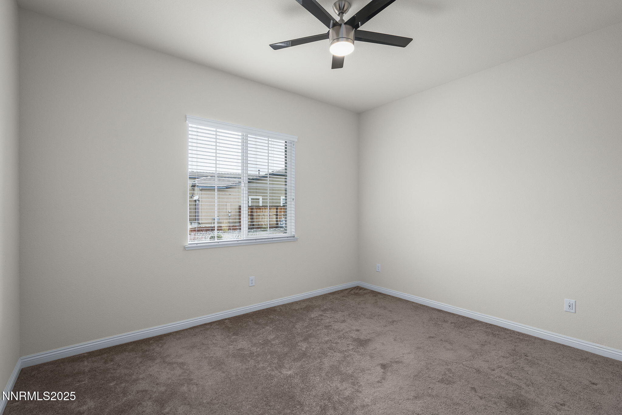 8326 Simsbury Drive Reno, NV 89439 - Photo 21 of 33 an empty room with a window