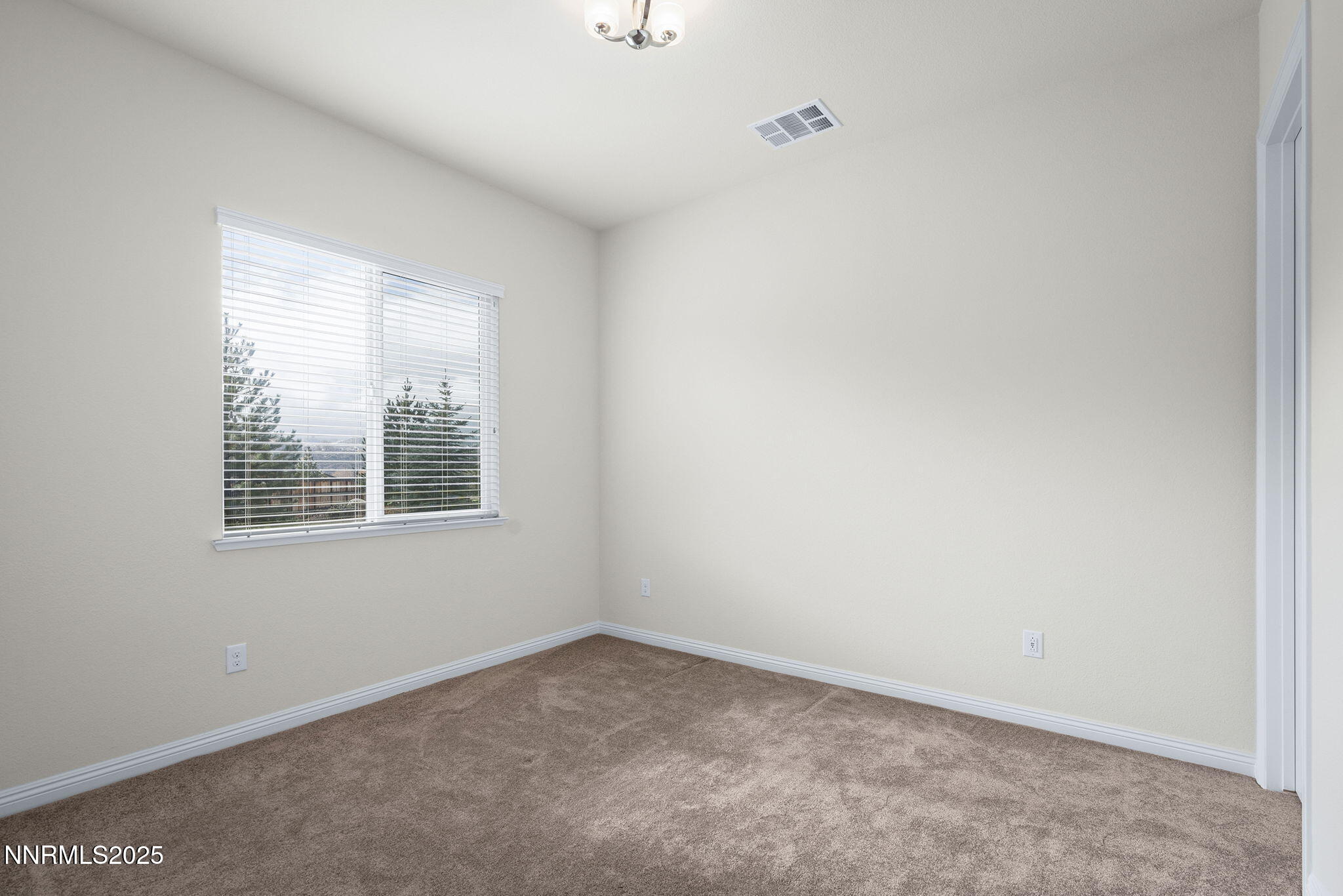 8326 Simsbury Drive Reno, NV 89439 - Photo 22 of 33 an empty room with a window