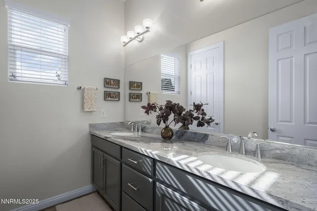 a bathroom with a toilet and a shower curtain