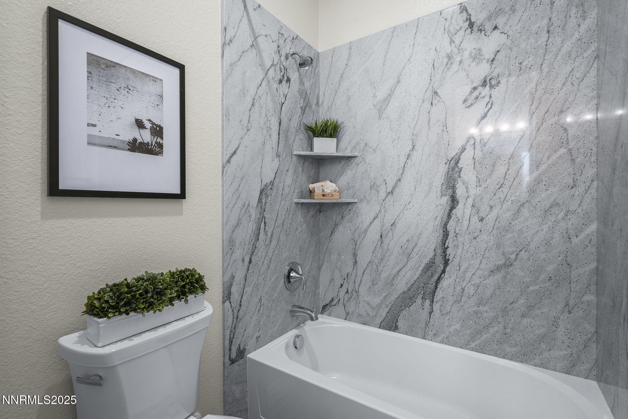 8326 Simsbury Drive Reno, NV 89439 - Photo 24 of 33 a bathroom with a toilet and a shower curtain