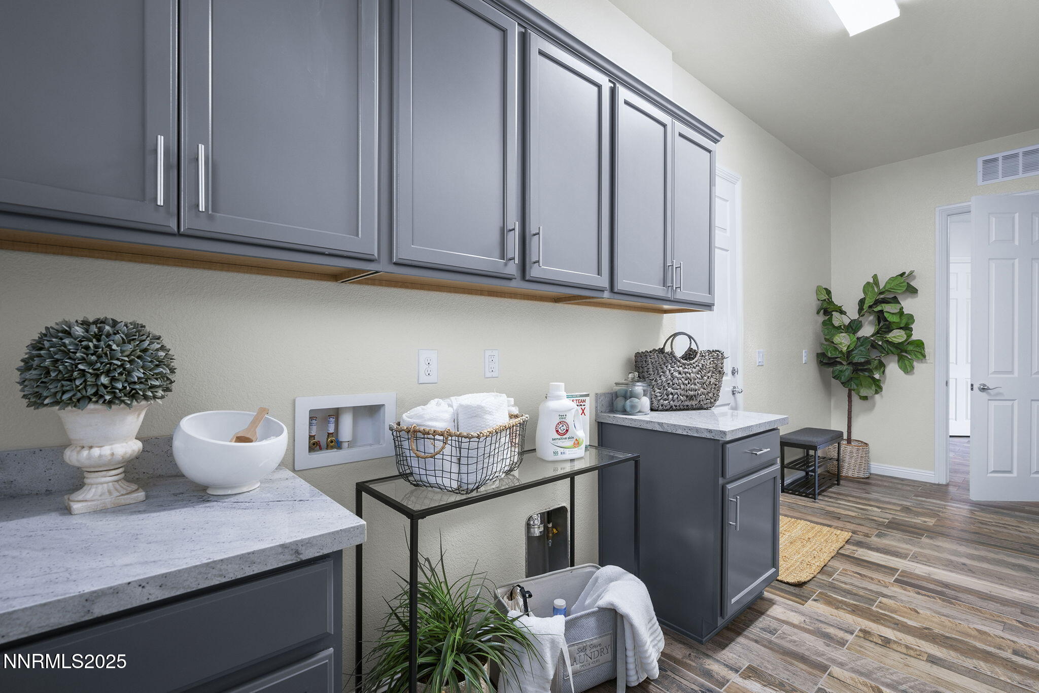 8326 Simsbury Drive Reno, NV 89439 - Photo 25 of 33 a kitchen with stainless steel appliances a sink a stove cabinets and wooden floor