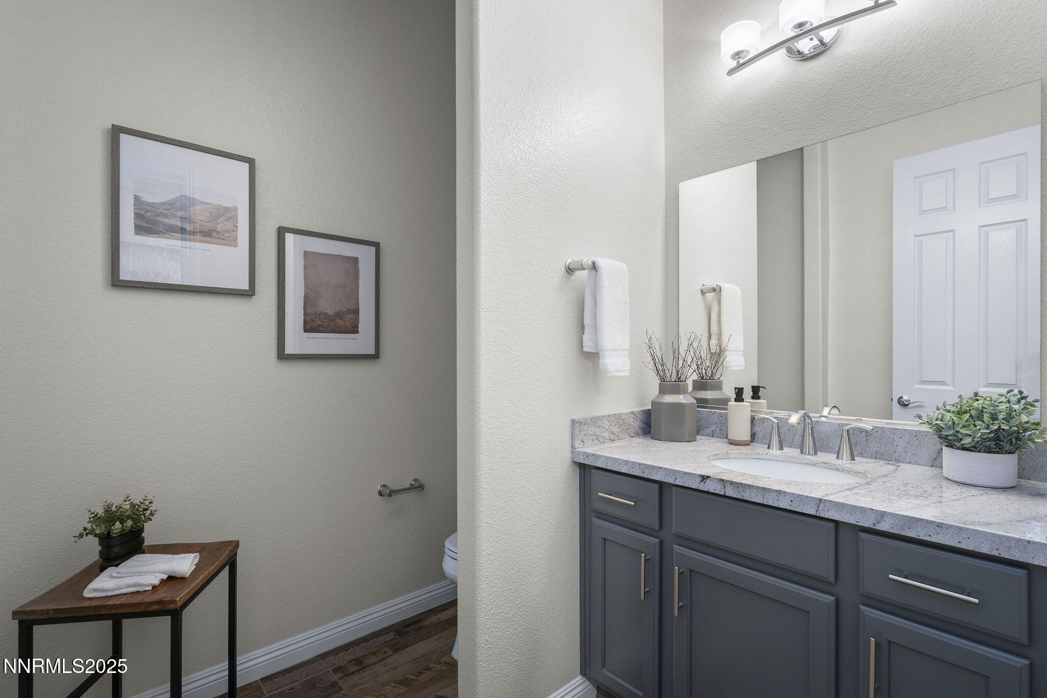 8326 Simsbury Drive Reno, NV 89439 - Photo 26 of 33 a bathroom with a sink and a mirror