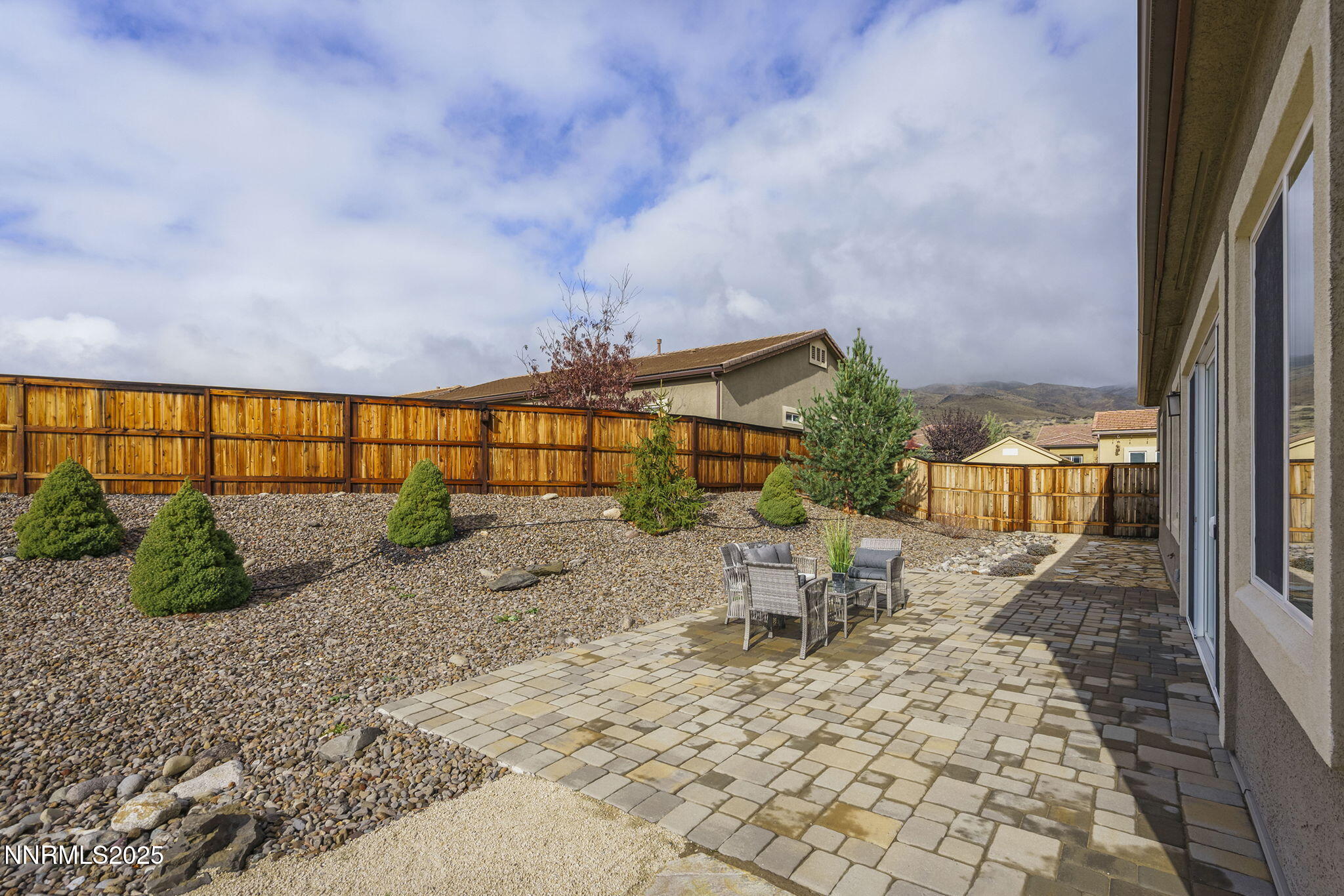 8326 Simsbury Drive Reno, NV 89439 - Photo 29 of 33 a view of a chairs and table in backyard