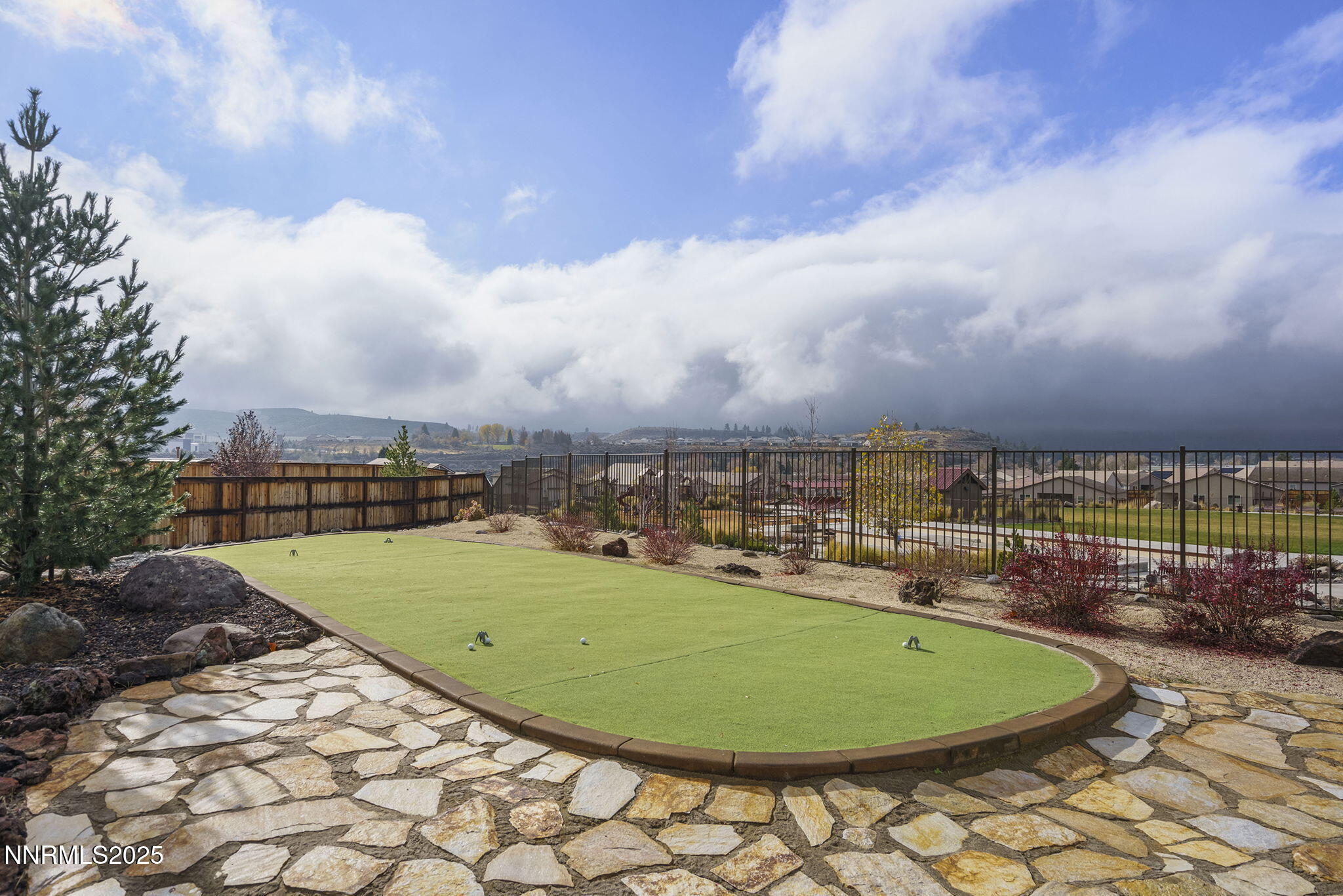 8326 Simsbury Drive Reno, NV 89439 - Photo 32 of 33 a view of a swimming pool with a yard