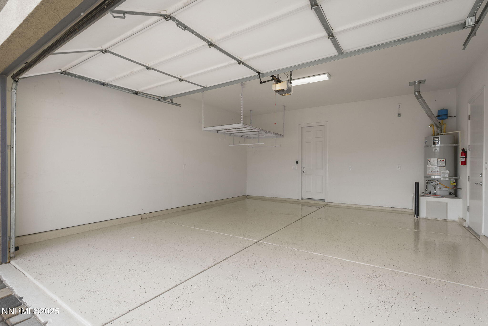 8326 Simsbury Drive Reno, NV 89439 - Photo 33 of 33 a view of a room with racks on the wall