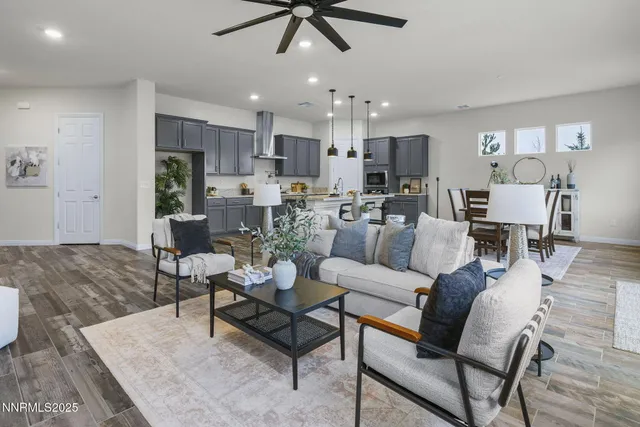 a living room with furniture and kitchen view
