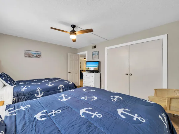 a bathroom with a toilet a sink and a mirror