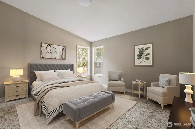 a bedroom with a bed and a couch