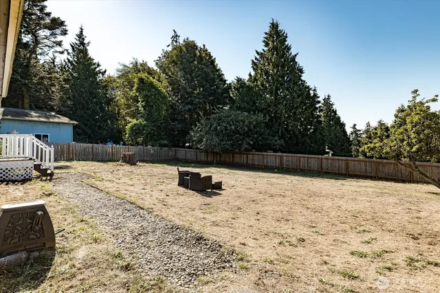 a swimming pool with wooden fence
