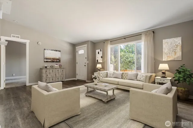 a living room with furniture and a large window