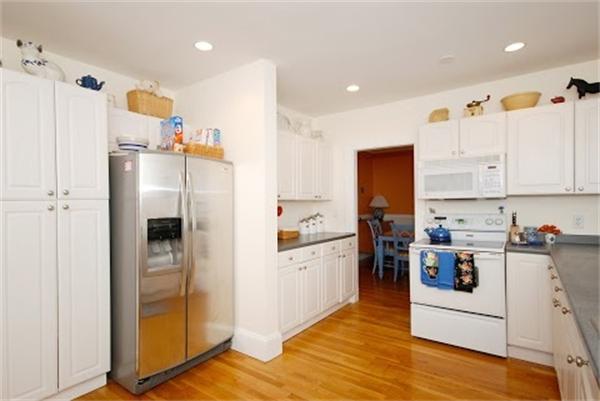 17 Cotter Road, Unit 17 Newton, MA 02468 - Photo 8 of 18 a kitchen with stainless steel appliances granite countertop a refrigerator and a stove top oven
