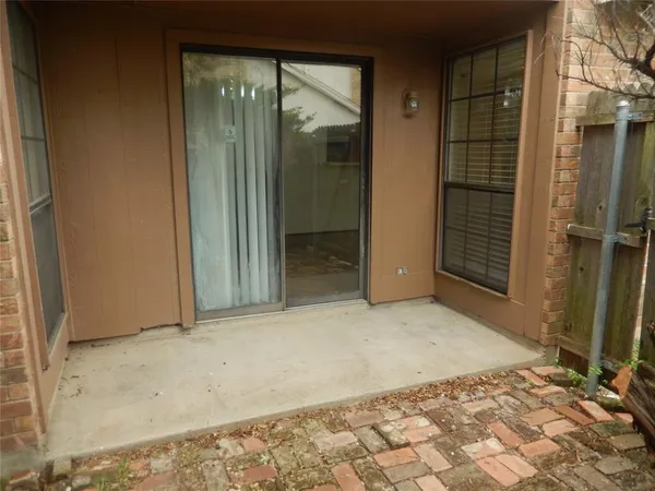 a view of backyard with entryway