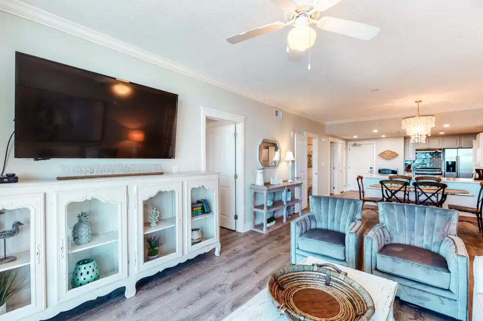 1110 Santa Rosa Boulevard, Unit A621 Fort Walton Beach, FL 32548 - Photo 4 of 20 a living room with furniture and a flat screen tv