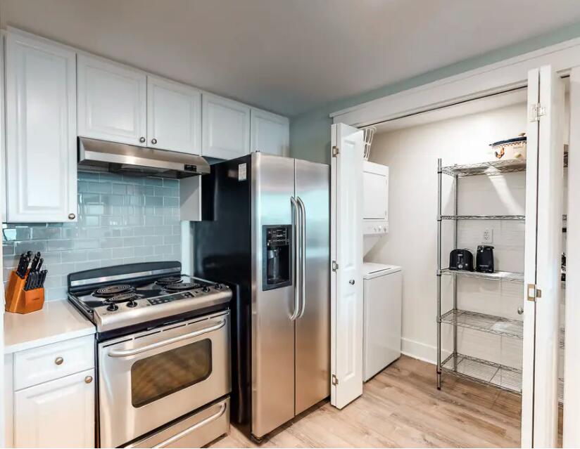 1110 Santa Rosa Boulevard, Unit A621 Fort Walton Beach, FL 32548 - Photo 6 of 20 a kitchen with stainless steel appliances a refrigerator a stove and white cabinets