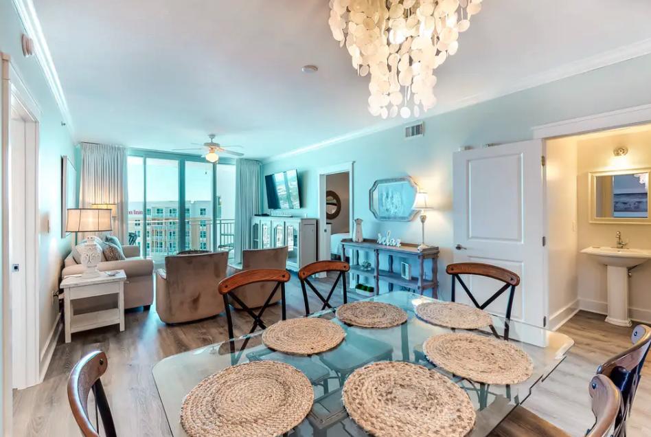 1110 Santa Rosa Boulevard, Unit A621 Fort Walton Beach, FL 32548 - Photo 7 of 20 a living room with furniture a dining table and chairs