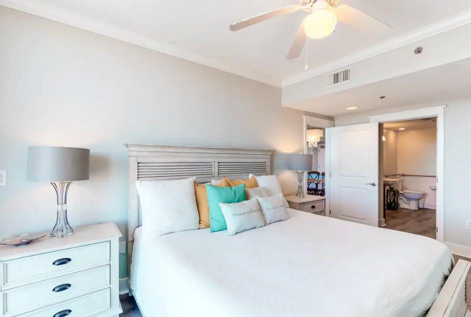 1110 Santa Rosa Boulevard, Unit A621 Fort Walton Beach, FL 32548 - Photo 8 of 20 a bedroom with a bed and a lamp