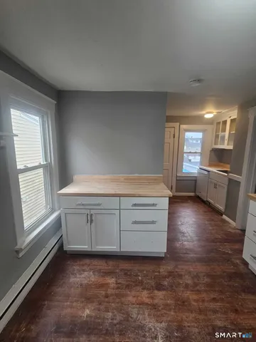 a room with window and cabinet