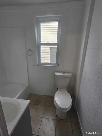 a bathroom with a toilet and a sink