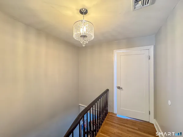 a view of a livingroom with furniture and a chandelier