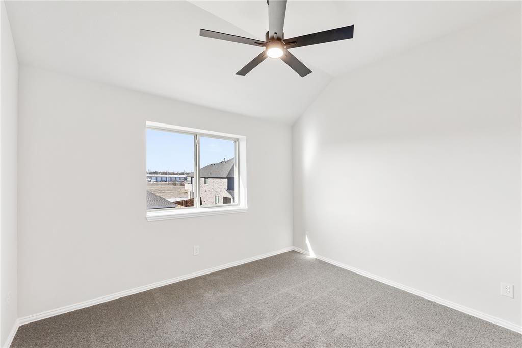 8 Grouse Circle Sanger, TX 76266 - Photo 32 of 40 an empty room with a window and a fan