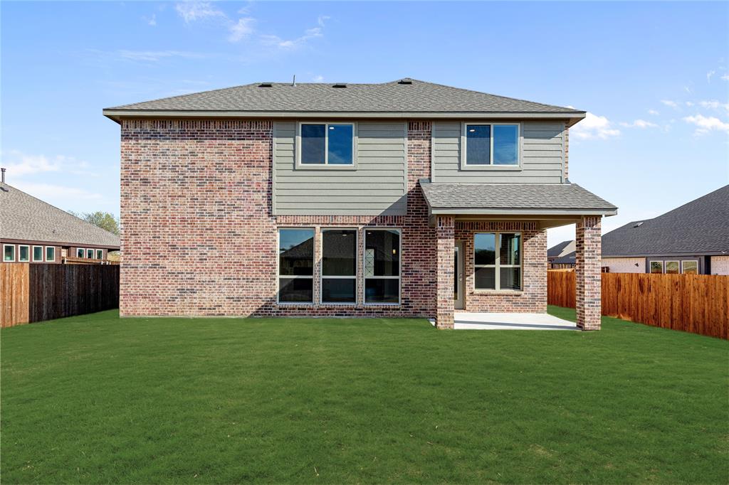 8 Grouse Circle Sanger, TX 76266 - Photo 38 of 40 a front view of a house with a yard