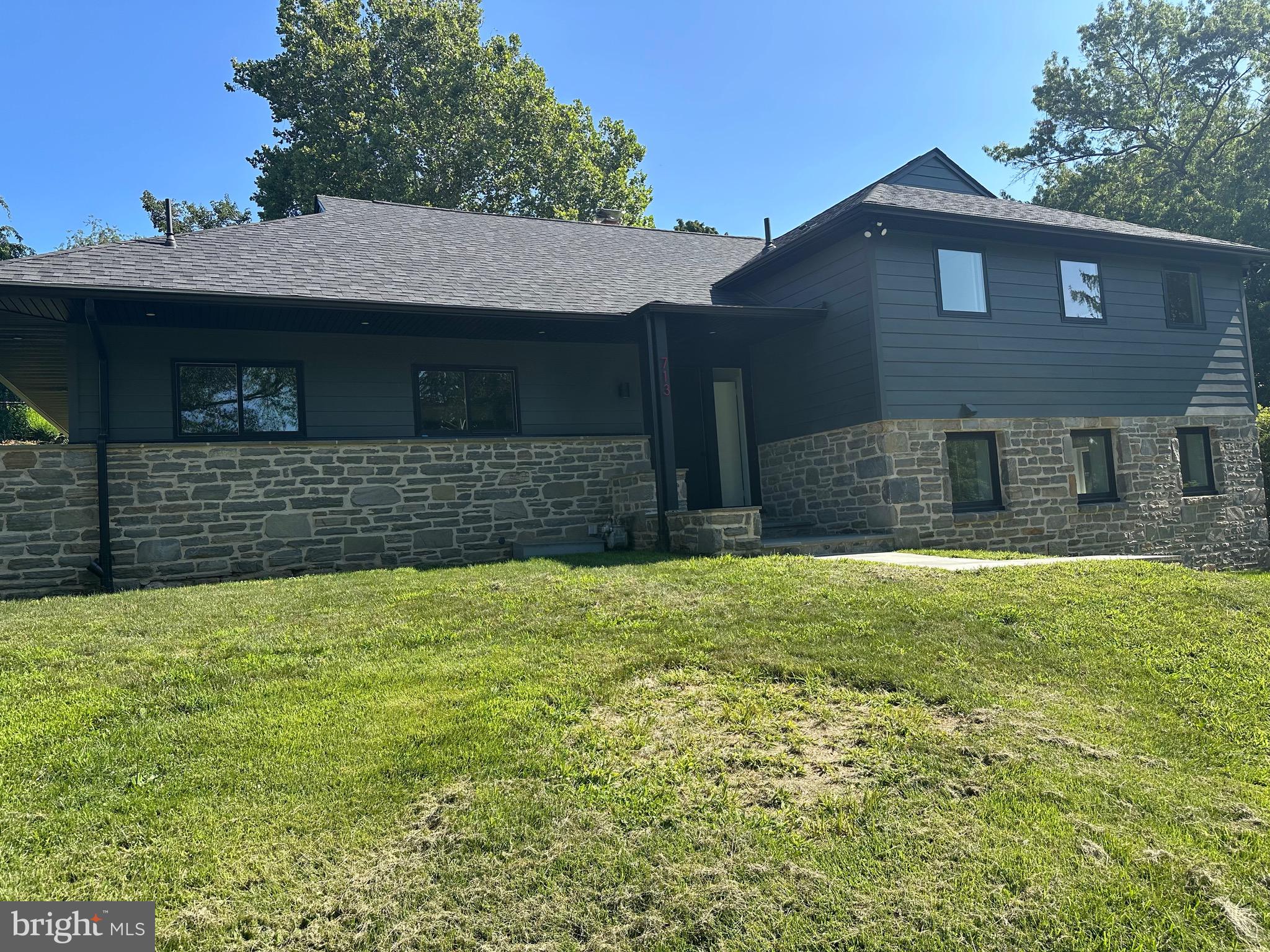 713 Woodfield Road Villanova, PA 19085 - Photo 27 of 37 a front view of a house with a yard
