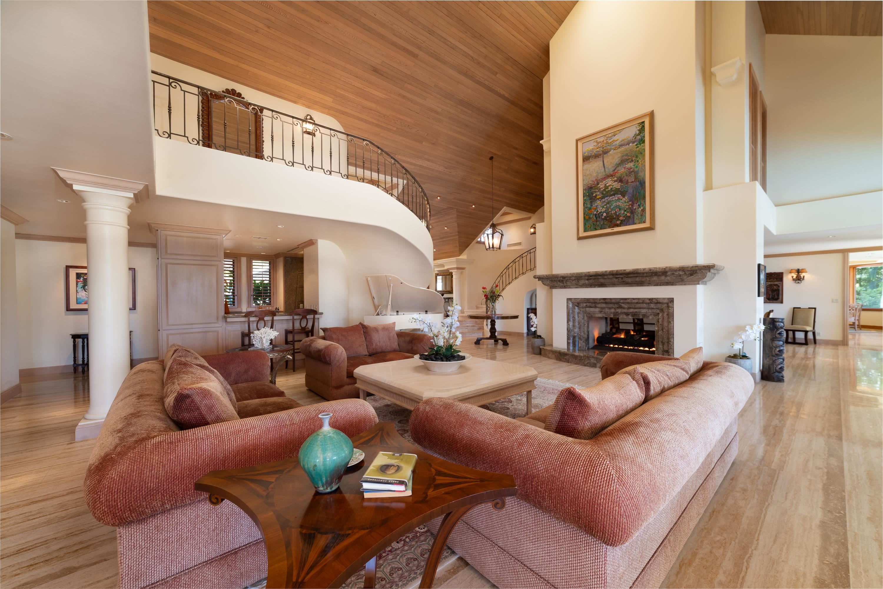 1216 Summer Road Lahaina, HI 96761 - Photo 13 of 26 a living room with furniture a fireplace and paintings on the wall