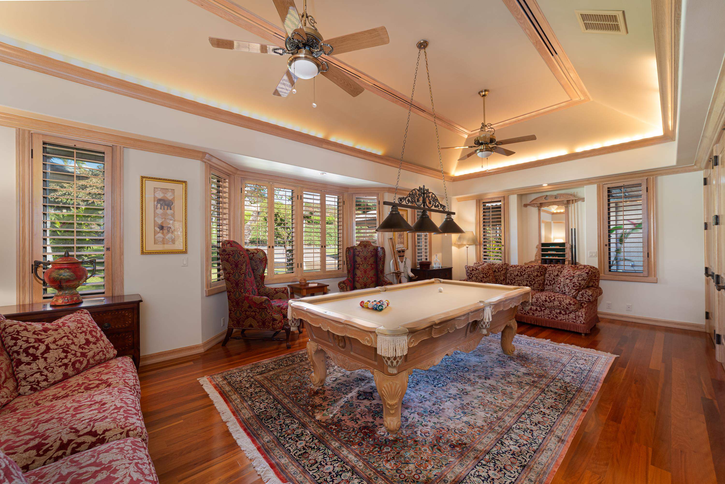 1216 Summer Road Lahaina, HI 96761 - Photo 14 of 26 a living room with furniture a table and wooden floor