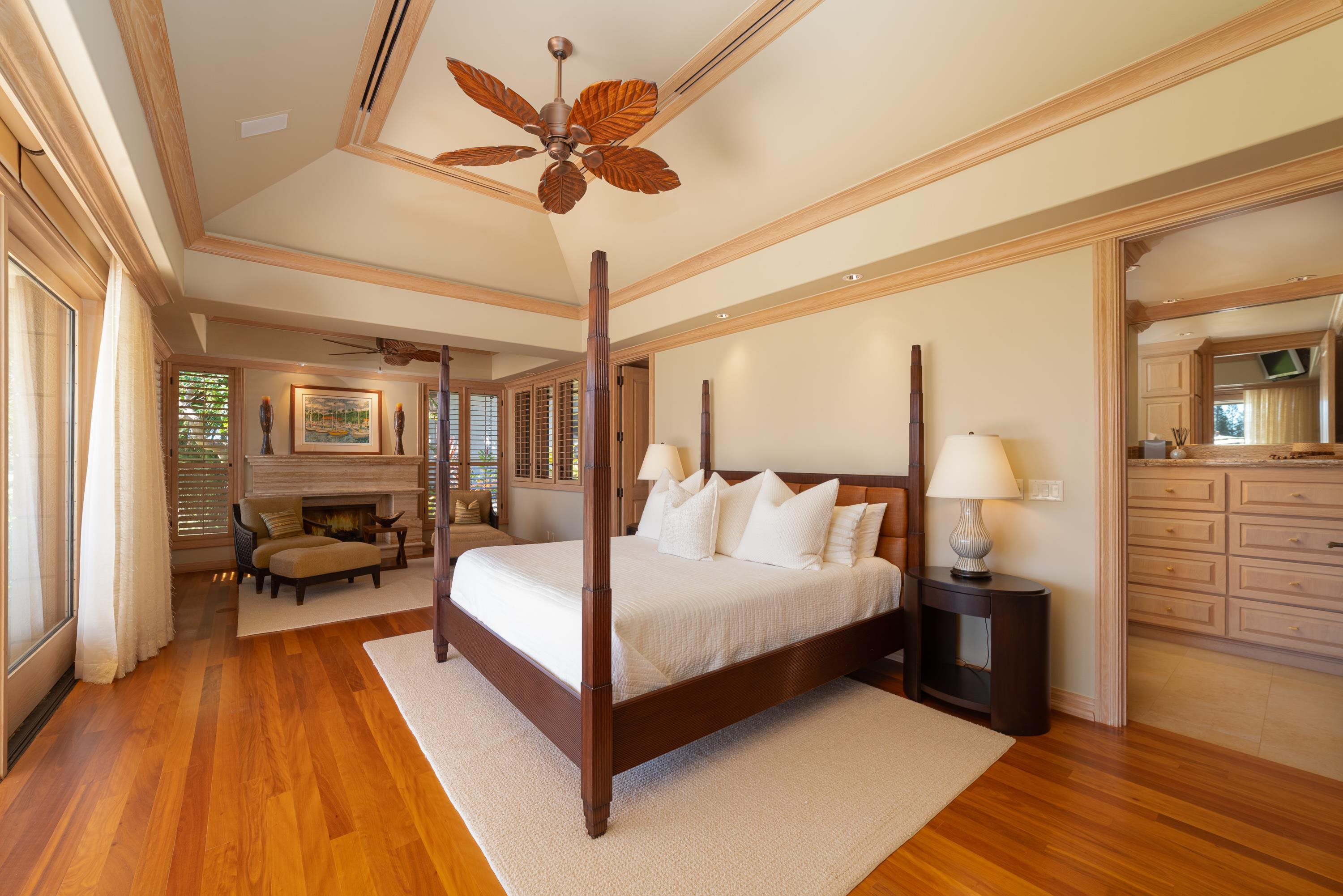 1216 Summer Road Lahaina, HI 96761 - Photo 15 of 26 a bedroom with a large bed and a chandelier