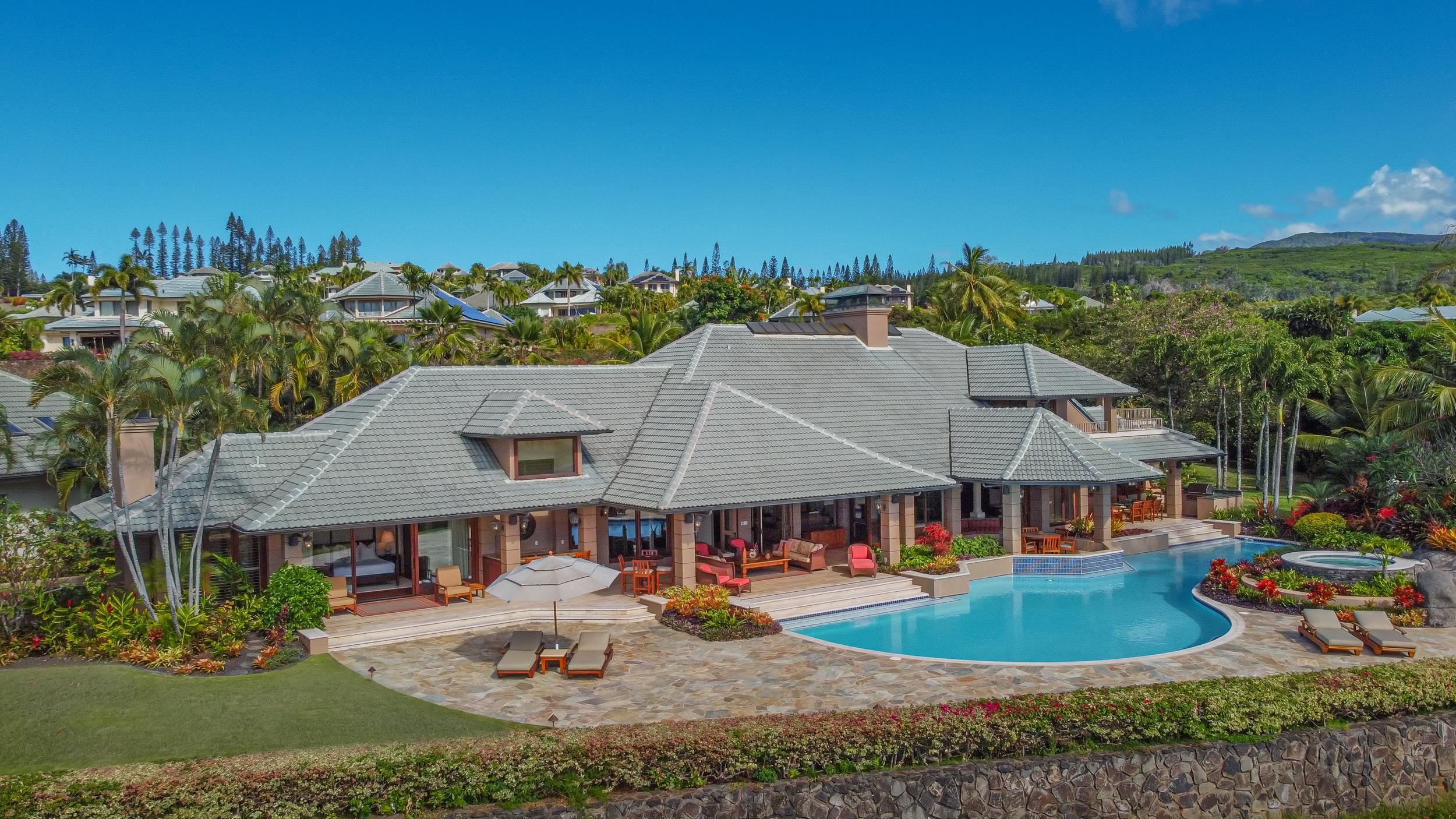 1216 Summer Road Lahaina, HI 96761 - Photo 2 of 26 an aerial view of a house with swimming pool and mountains