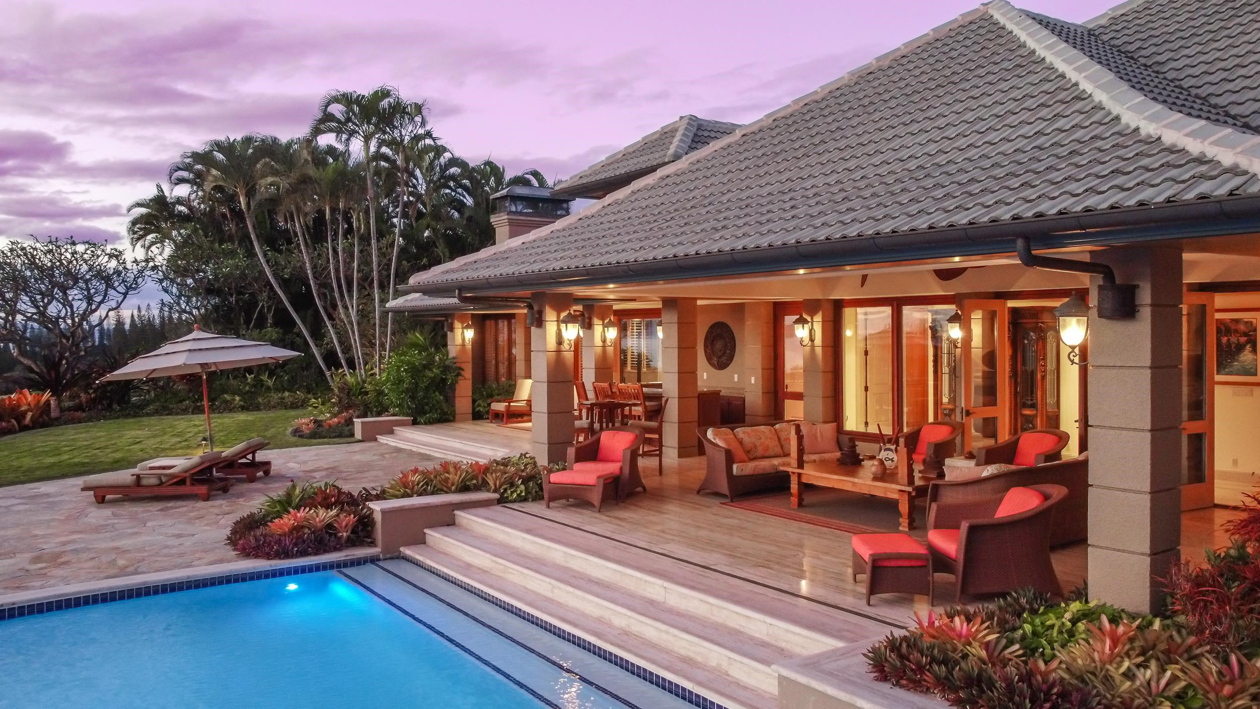 1216 Summer Road Lahaina, HI 96761 - Photo 22 of 26 a view of a patio with table and chairs potted plants and palm trees