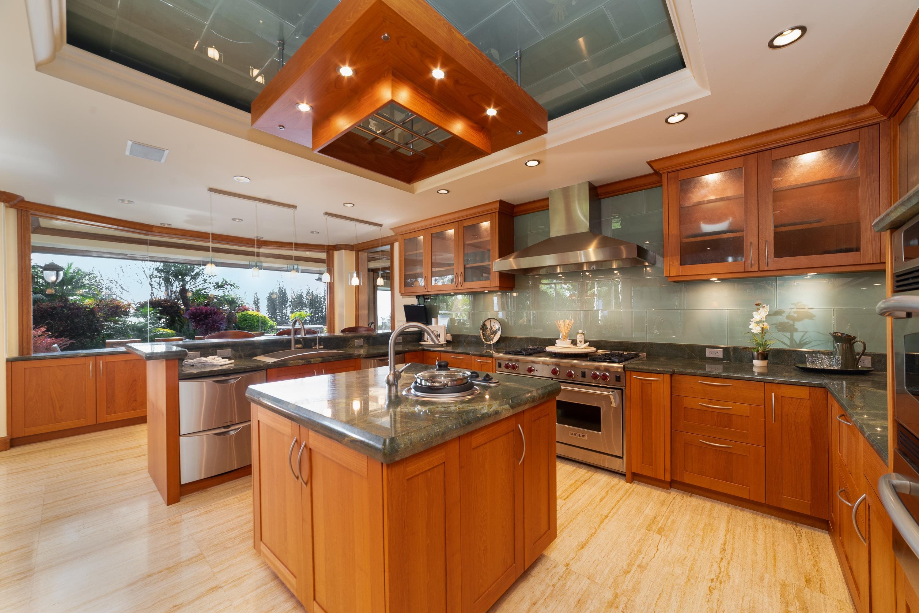 1216 Summer Road Lahaina, HI 96761 - Photo 8 of 26 a kitchen with stainless steel appliances granite countertop stove top oven and cabinets