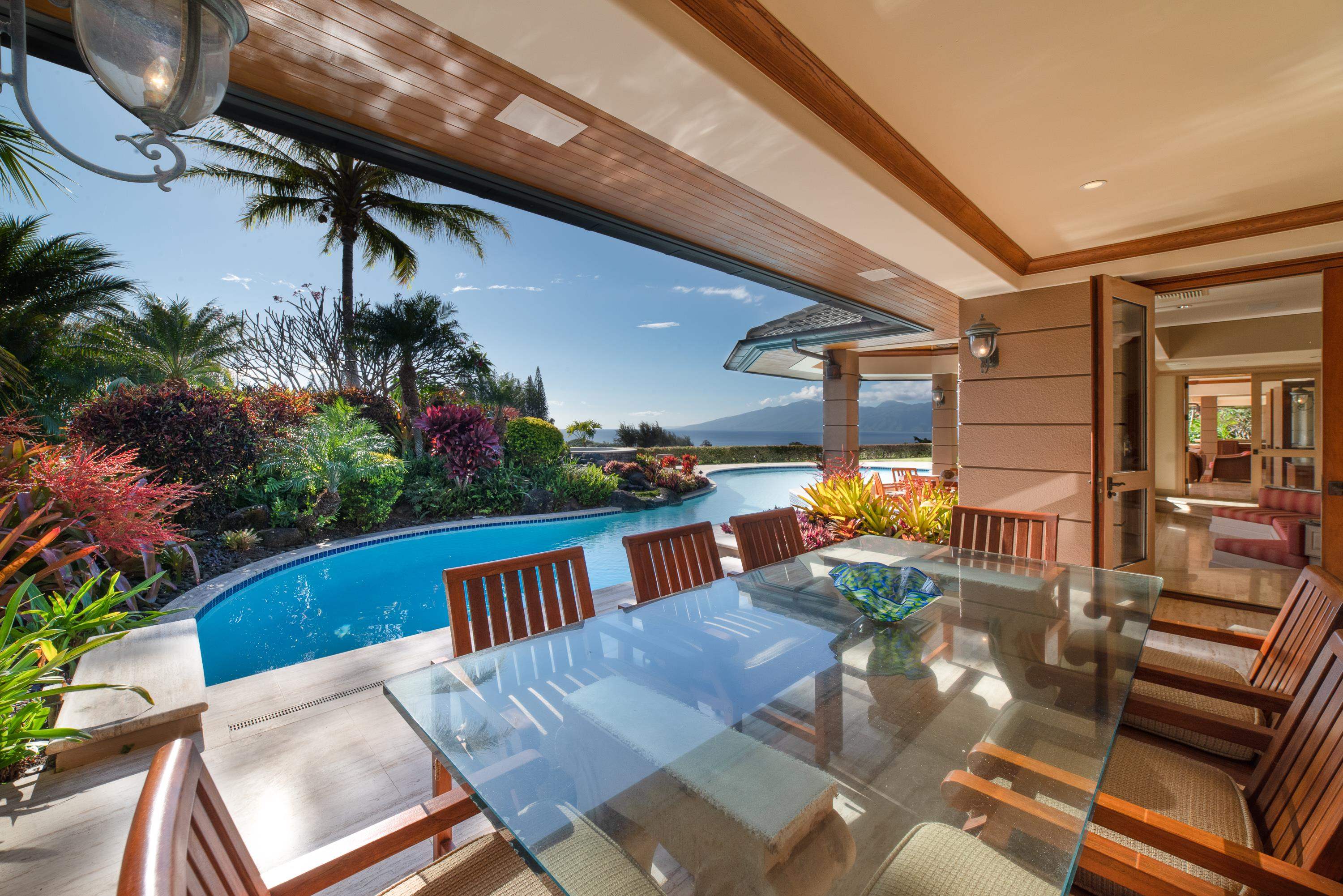 1216 Summer Road Lahaina, HI 96761 - Photo 9 of 26 a view of a patio with couches table and chairs with potted plants