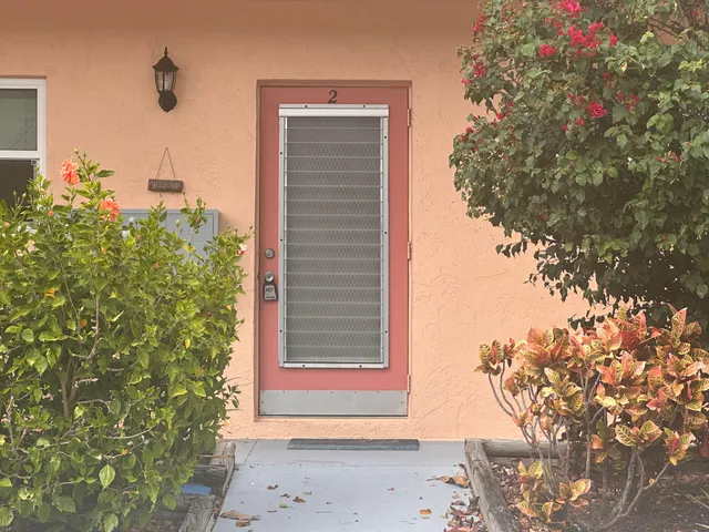a view of a house with a tree