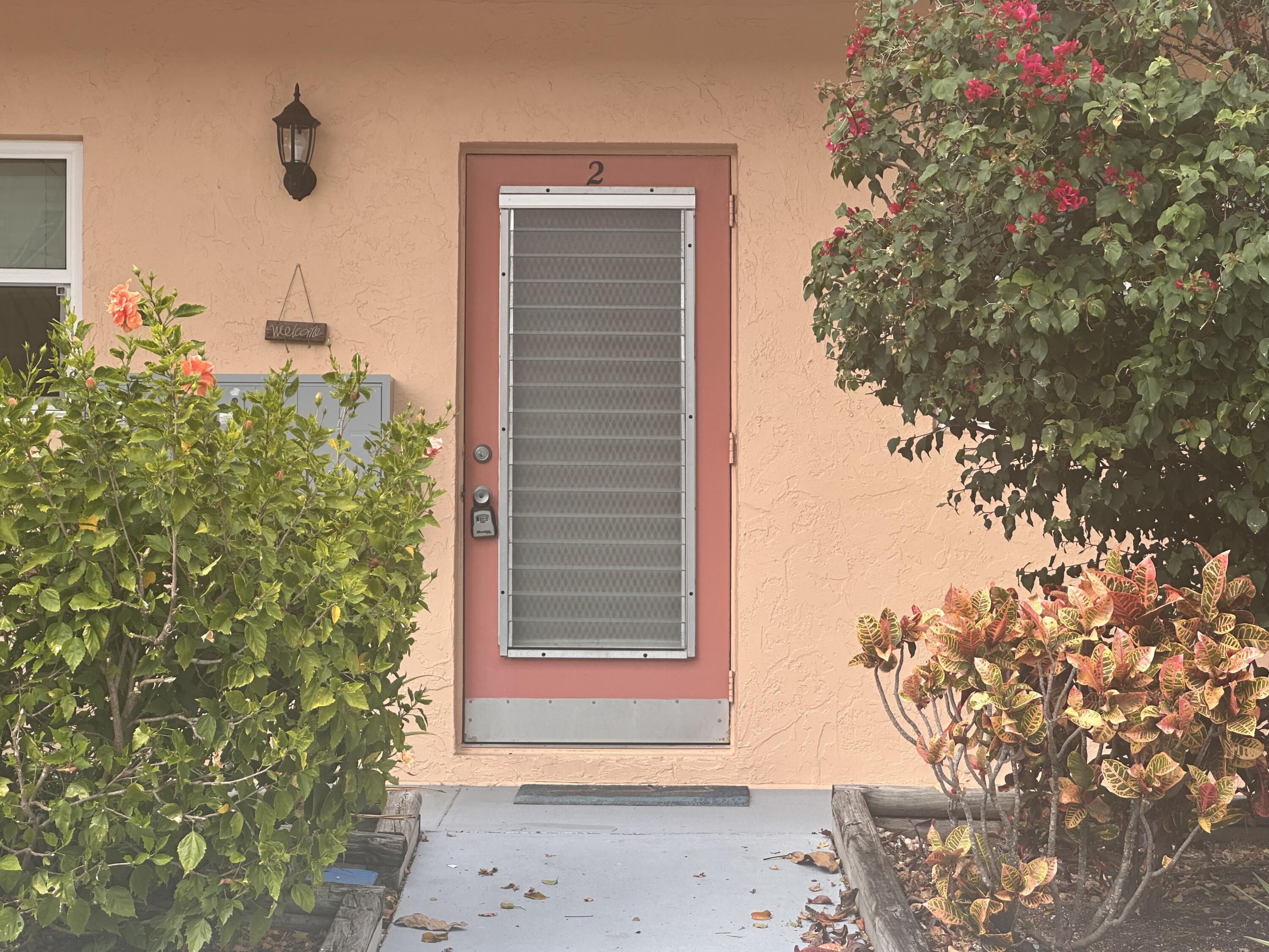 2950 Southeast Ocean Boulevard, Unit 182 Stuart, FL 34996 - Photo 13 of 13 a view of a house with a tree