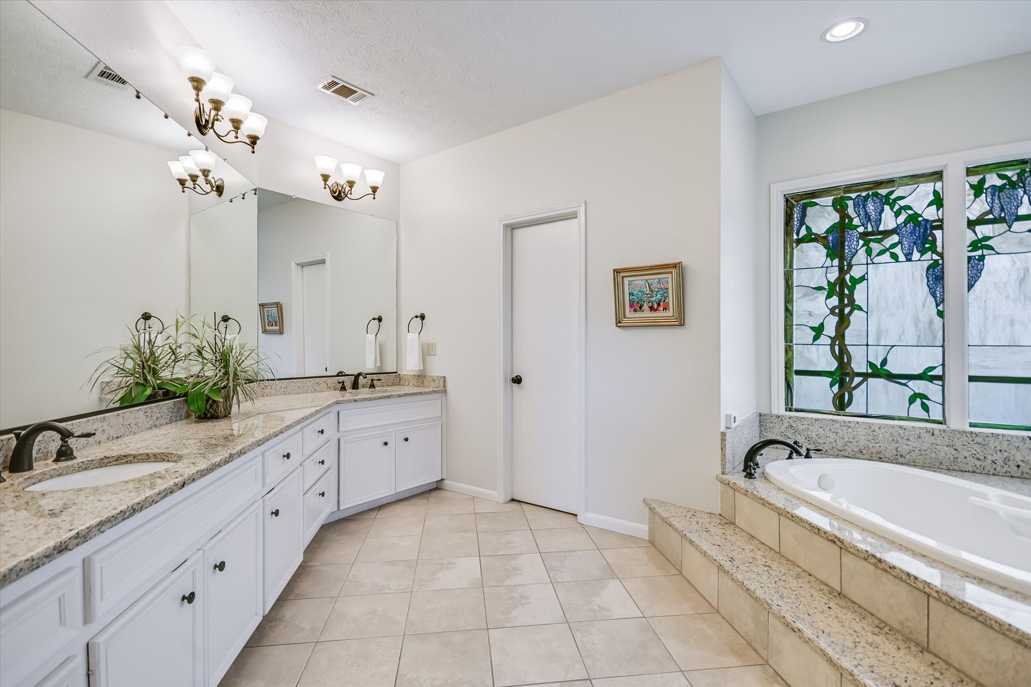 3901 Prentice Lane Austin, TX 78746 - Photo 14 of 40 The primary bathroom offers a spacious layout designed for everyday comfort.