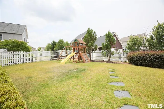a view of a playground with basketball court