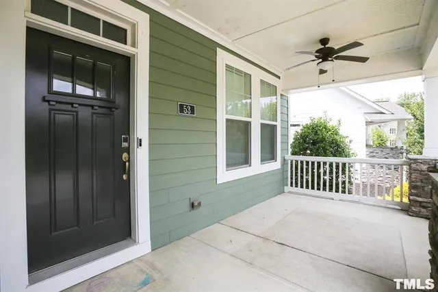 a view of a balcony with a ceiling fan
