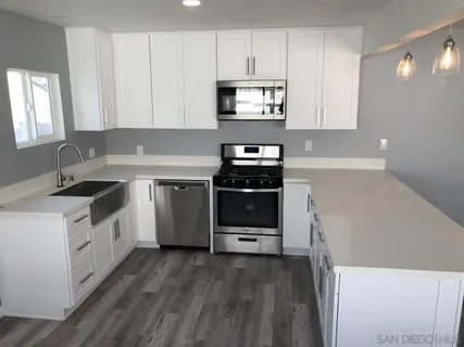 a bathroom with a sink and mirror
