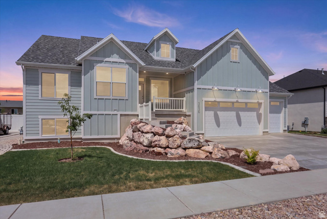 3636 West 910 South Syracuse, UT 84075 - Photo 2 of 70 Contemporary exterior featuring light blue siding with white trim accents and a dark shingle roof