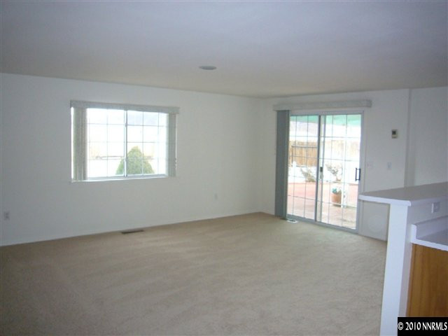 568 Yellow Jacket Road Dayton, NV 89403 - Photo 6 of 13 an empty room with windows