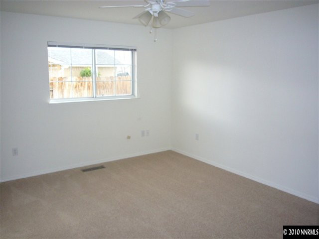 568 Yellow Jacket Road Dayton, NV 89403 - Photo 8 of 13 an empty room with a window