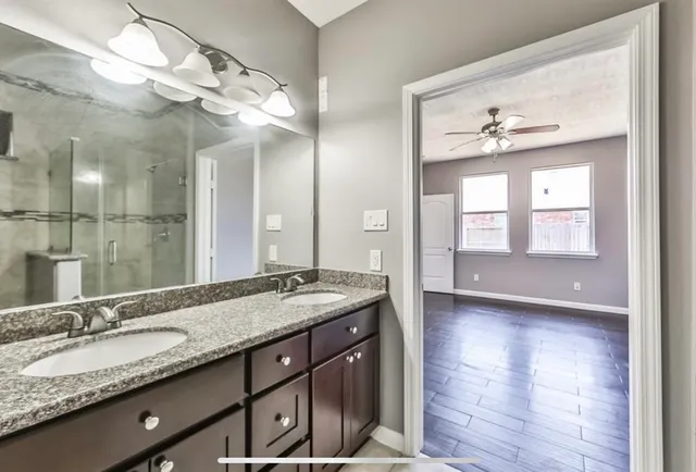 a bathroom with a bathtub and a shower